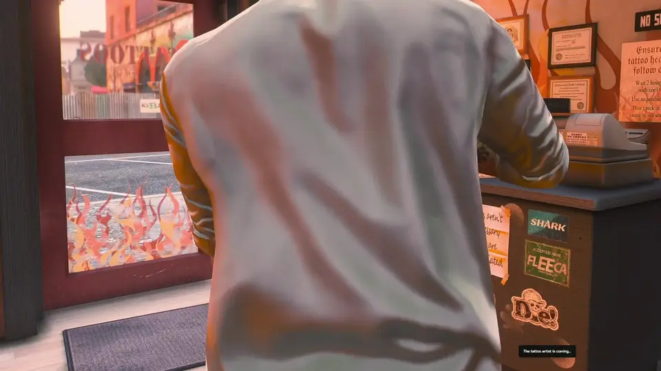 NPC artist applying a tattoo